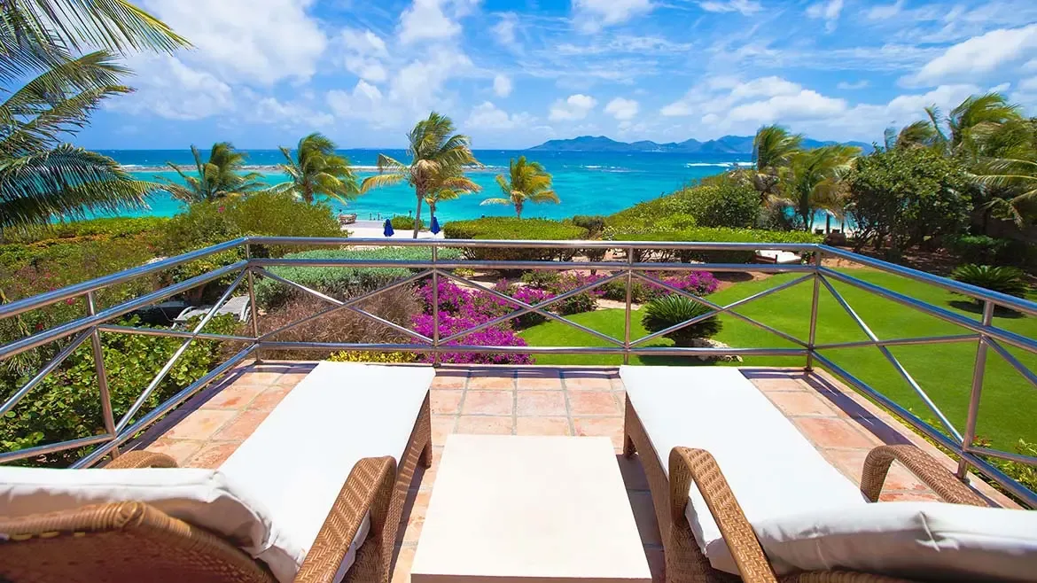 Experience unparalleled Caribbean luxury from the private sun terrace of Villa Indigo, overlooking the turquoise waters of Little Harbour. This stunning Anguilla villa rental offers a serene escape with panoramic ocean views, lush tropical gardens, and sophisticated outdoor living spaces.