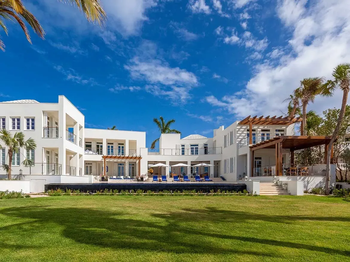 Experience the ultimate island retreat at Cerulean, a breathtaking luxury villa rental in Anguilla featuring modern white architecture and a sprawling infinity pool. This premier private estate offers expansive outdoor living spaces and manicured lawns for an unparalleled Caribbean getaway.