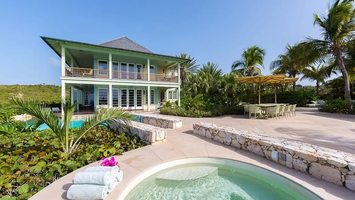 As dusk settles over Long Bay, Villa Santosha stands as a beacon of luxury, perfectly positioned to capture breathtaking Caribbean sunset views from its private beachfront sanctuary.