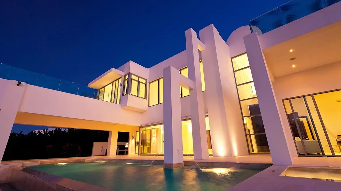 Experience unparalleled Caribbean elegance at this modern Anguilla beach house, featuring striking architectural design and a stunning private pool illuminated for evening relaxation. This luxury villa rental offers a seamless indoor-outdoor living experience, perfect for those seeking an exclusive and sophisticated island retreat.