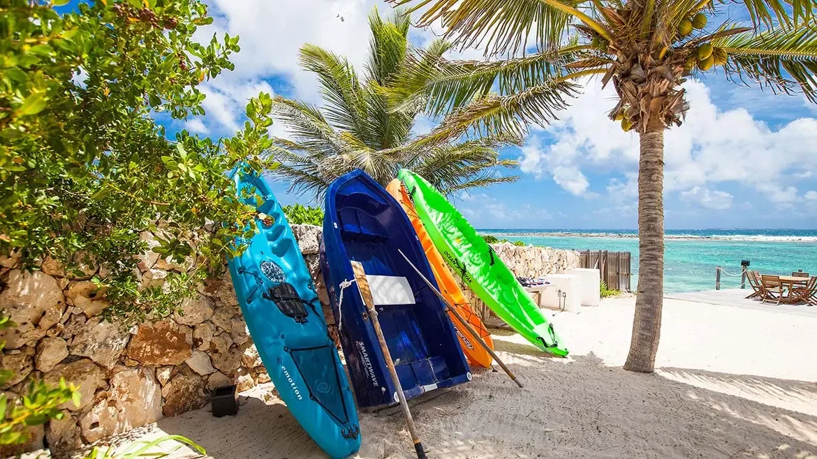 Guests at the luxurious Villa Indigo can enjoy direct access to the pristine shores of Anguilla with colorful kayaks ready for an afternoon of exploring the turquoise waters. This stunning beachfront property offers the perfect blend of island adventure and serene relaxation in a breathtaking Caribbean setting.