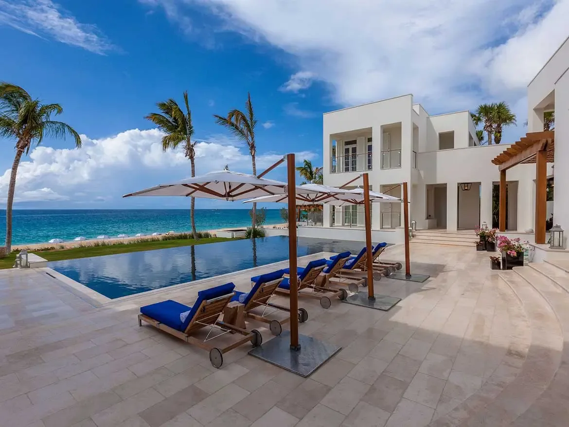 Experience the pinnacle of Caribbean luxury at Cerulean Villa, featuring a breathtaking infinity pool that overlooks the crystalline waters of Anguilla. This exquisite beachfront estate offers a serene terrace with plush loungers and private beach access, perfect for an unforgettable upscale getaway.