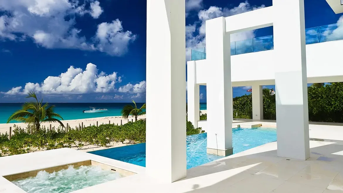Experience unparalleled contemporary luxury at this striking Anguilla beach house featuring a private infinity pool and sleek geometric architecture. Overlooking the turquoise Caribbean Sea, this premier oceanfront rental offers an exclusive sanctuary just steps from the pristine white sand.