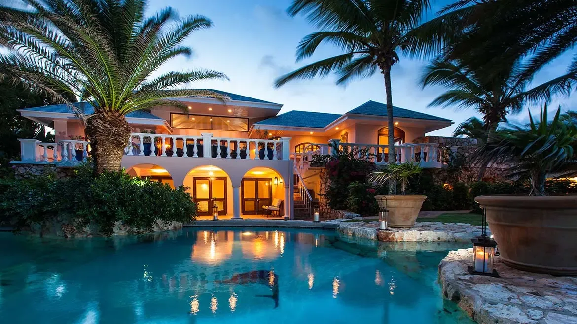 Experience ultimate Caribbean luxury at Villa Indigo in Anguilla, featuring a stunning beachfront pool and expansive terraces perfect for evening relaxation. This elegant island estate offers sophisticated indoor-outdoor living with breathtaking views, making it the premier choice for a tropical getaway.