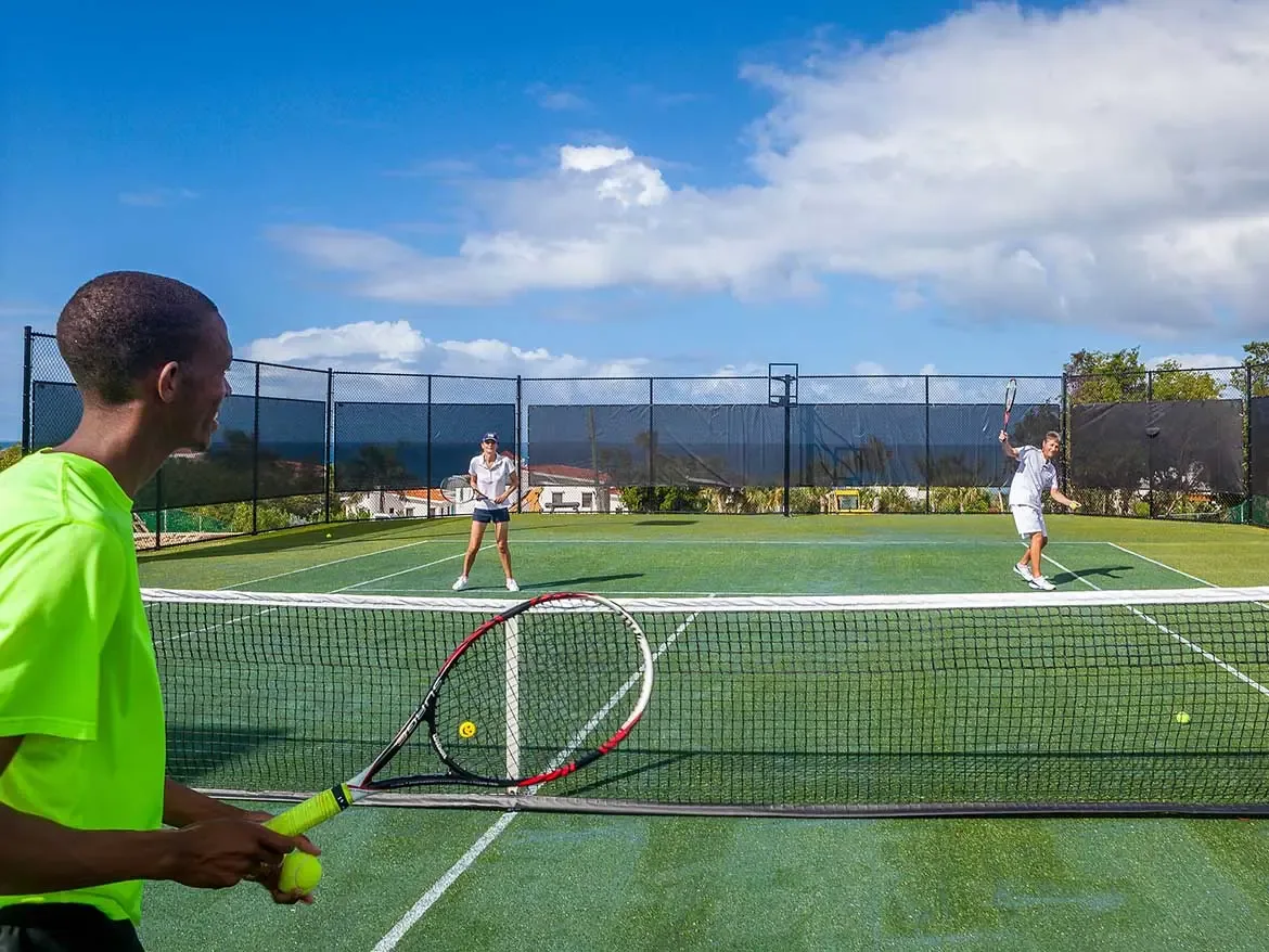 Enjoy a private match on the professional-grade tennis court at Cerulean, offering guests the perfect blend of sport and luxury in Anguilla. This premier villa amenity provides a beautiful setting for an active afternoon while taking in the island's coastal breeze.