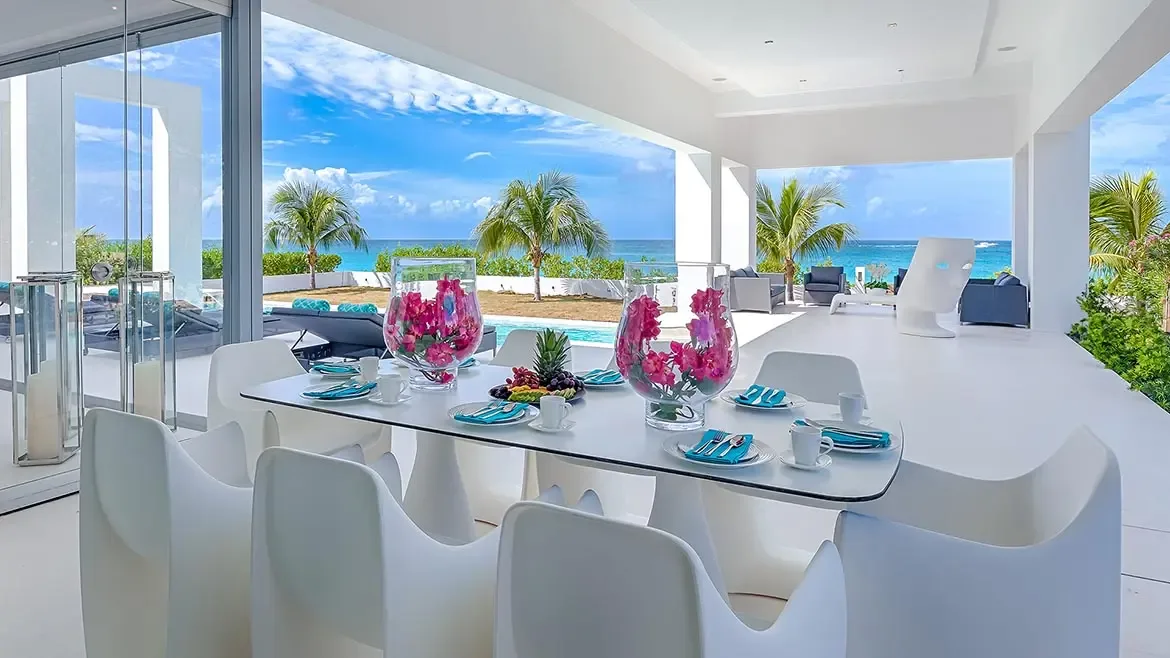 Experience the epitome of Caribbean elegance at this luxury Anguilla beach house, featuring a modern al fresco dining area with breathtaking ocean views. This stunning villa rental offers a seamless indoor-outdoor lifestyle, perfect for enjoying gourmet meals by the private poolside.