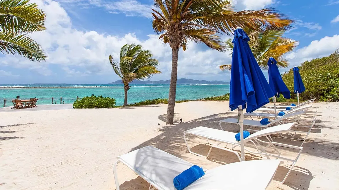 Experience the ultimate Caribbean escape at Villa Indigo, where pristine white sands meet the vibrant turquoise waters of Anguilla. This luxury beachfront villa offers a serene private oasis complete with shaded lounge areas, perfect for soaking in the sun and breathtaking ocean views.