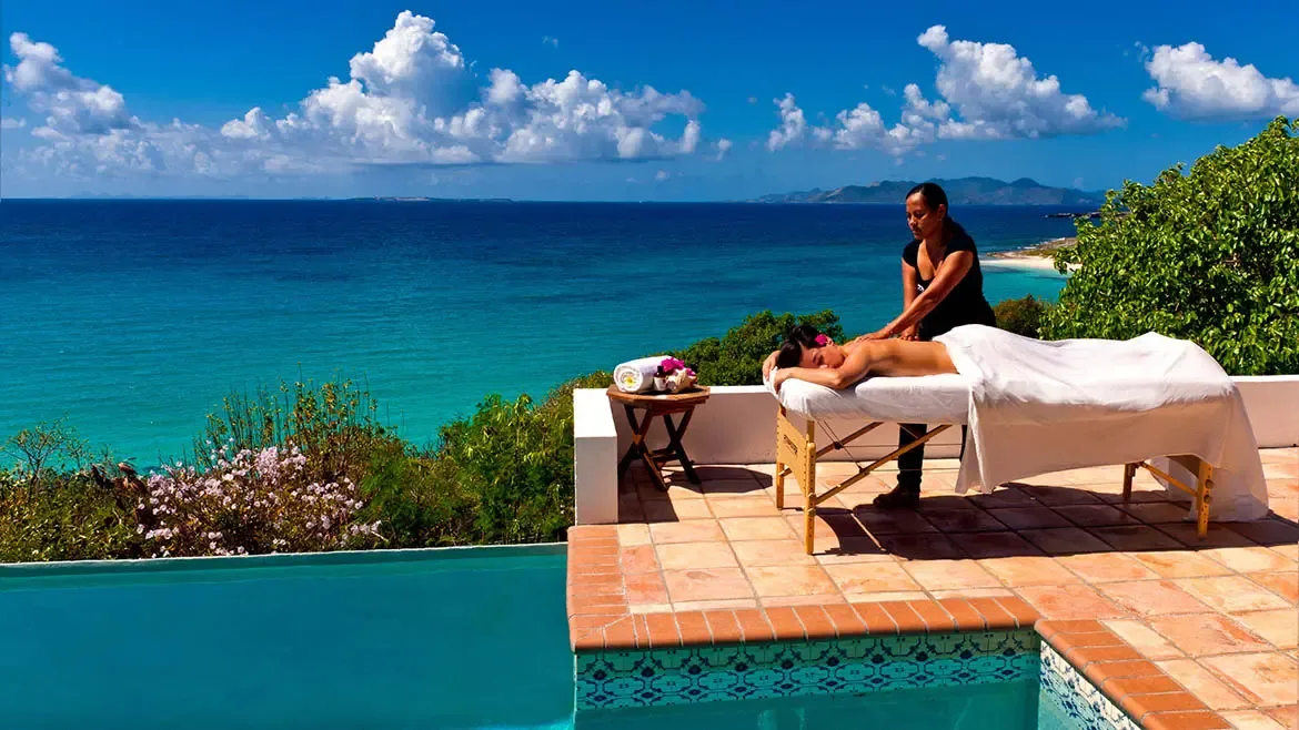 Experience pure serenity with a private outdoor massage at Zenaida Estate, the highest elevation on the island. Surrounded by three acres of lush tropical gardens, this tranquil terrace offers sweeping views of the turquoise Caribbean Sea, creating a world-class wellness retreat.