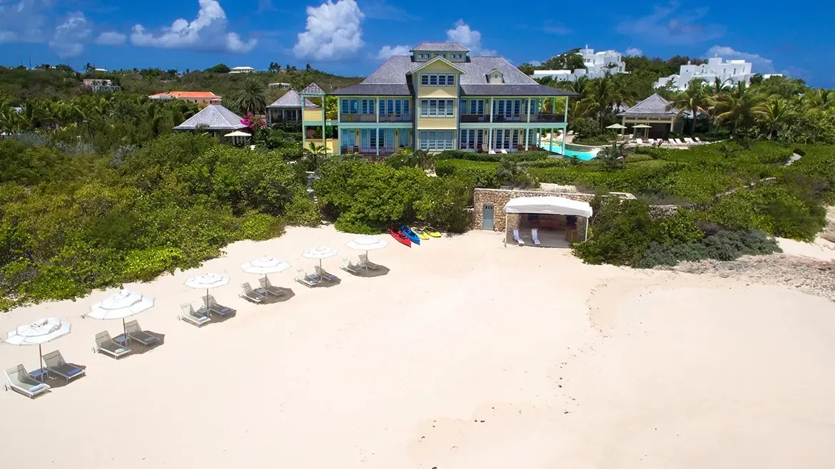 Find your focus in the impeccably designed private office at Villa Santosha. Situated in the heart of Long Bay, Anguilla, this elegant workspace centers around a magnificent live-edge desk, framed by lush tropical views for the ultimate remote-working experience amidst breathtaking Caribbean beauty.
