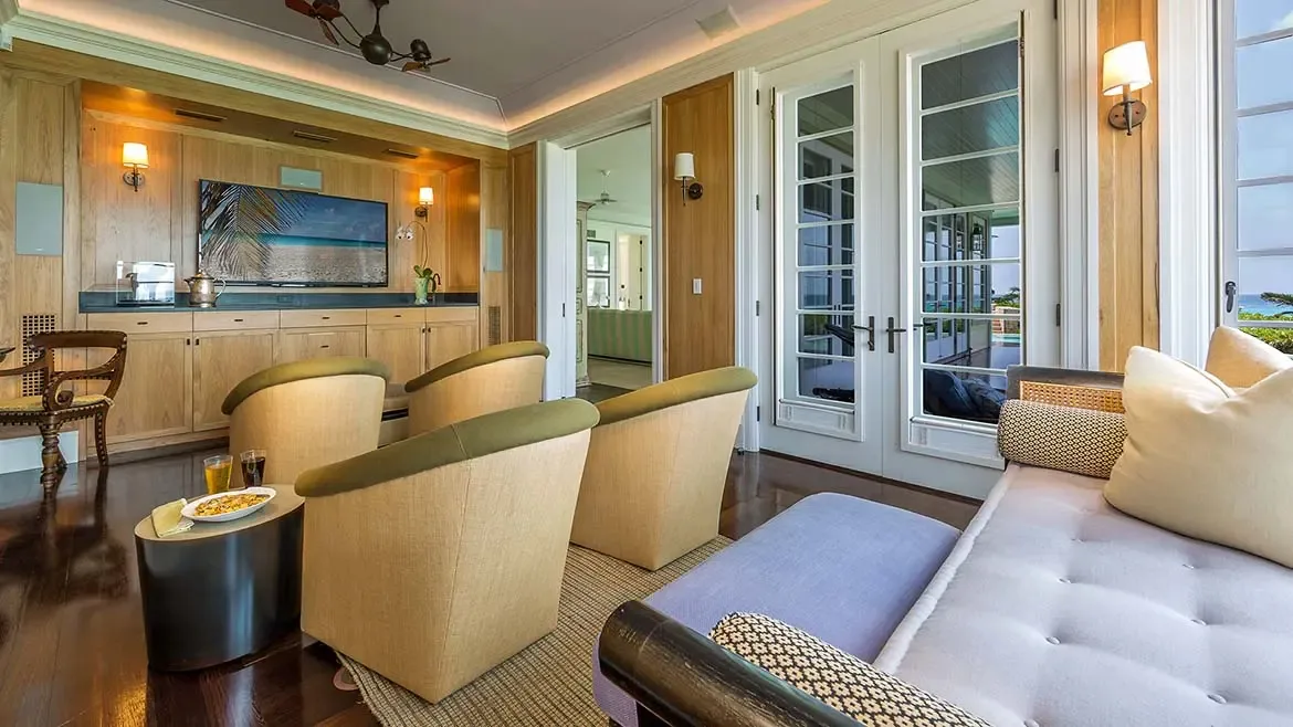 Awaken to the serene beauty of Long Bay in Villa Santosha's exquisite master suite, where classic Caribbean elegance meets breathtaking ocean views from every corner.