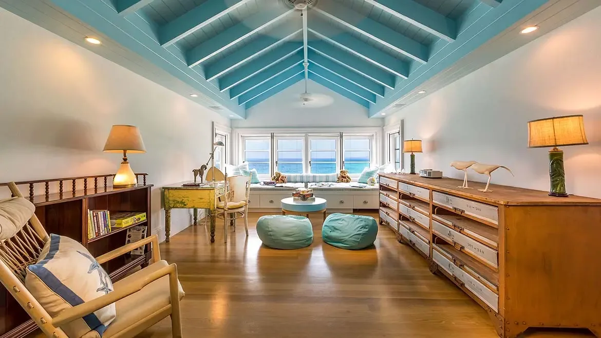 Experience coastal elegance in the beautifully appointed ensuite bathrooms at Villa Santosha, featuring bright tropical accents and premium finishes just steps from the sands of Long Bay.