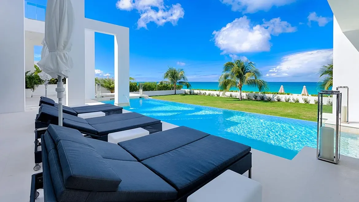 Experience unparalleled Caribbean elegance at this ultra-modern Anguilla villa featuring a pristine infinity pool and expansive sun deck. This beachfront sanctuary offers breathtaking views of turquoise waters, complete with designer loungers and seamless indoor-outdoor living for the ultimate luxury escape.