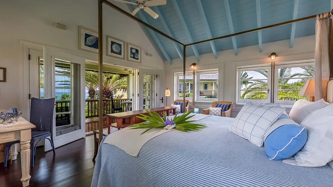 Discover secluded elegance at Villa Santosha, where charming guest houses are tucked away amidst lush tropical foliage, offering a private sanctuary within this magnificent Long Bay estate.