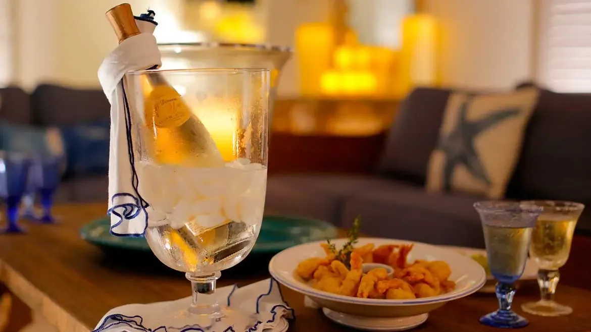 Experience ultimate luxury at Cerulean Villa with private, personalized beverage service and gourmet appetizers. Relax in the sophisticated living area while enjoying chilled champagne and hors d'oeuvres prepared by your dedicated staff.
