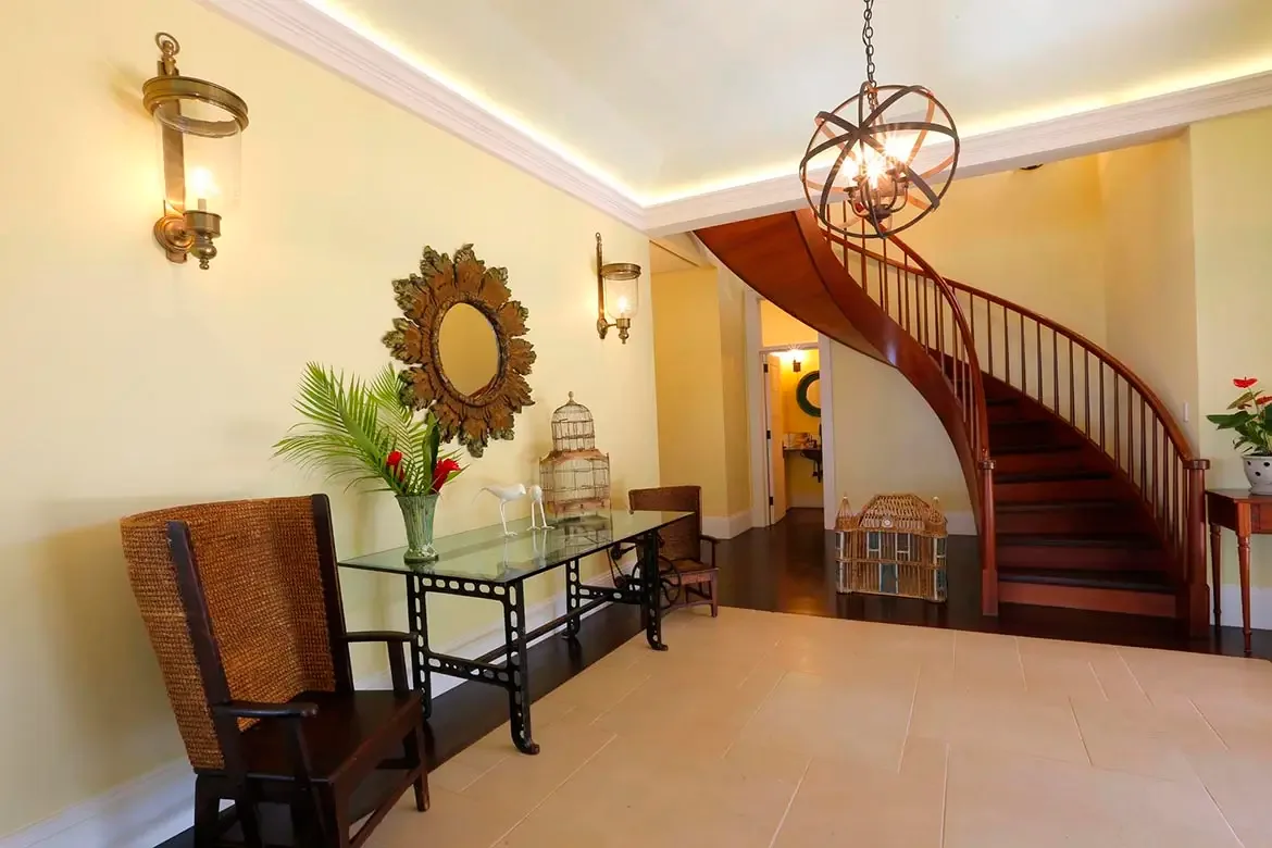 Sweeping panoramic views of Villa Santosha reveal the full grandeur of this exceptional Caribbean estate, where lush tropical gardens meet the pristine turquoise waters of Long Bay in a breathtaking display of natural beauty.