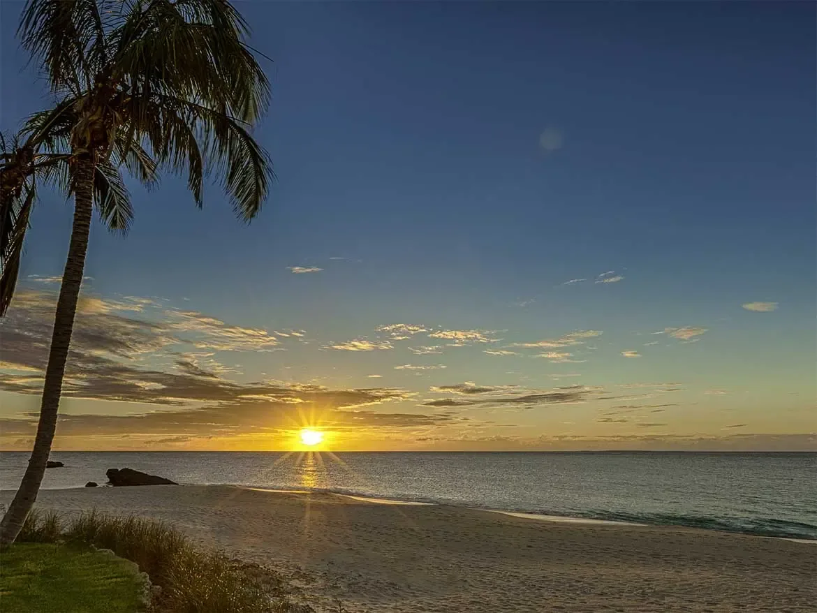 Experience breathtaking Caribbean sunsets from the private beachfront of Cerulean, a premier luxury villa rental in Anguilla. This tranquil tropical sanctuary offers guests direct access to pristine white sands and calm turquoise waters for the ultimate island getaway.