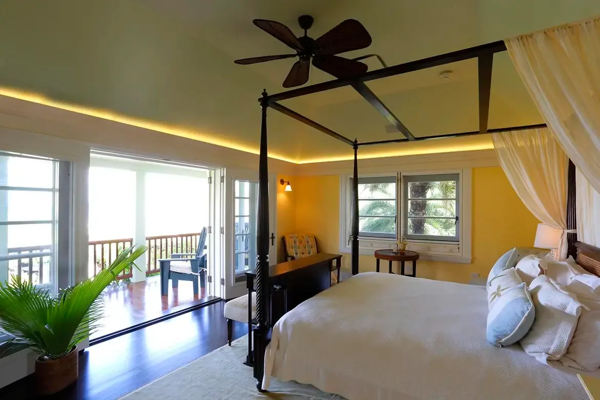 Villa Santosha's stunning pool area offers an idyllic setting for a refreshing swim, surrounded by the breathtaking beauty of Long Bay and the turquoise Caribbean Sea beyond.