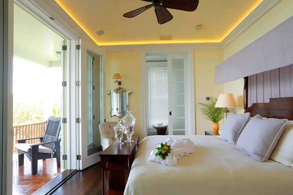 Your private balcony at Villa Santosha offers an uninterrupted view of the Caribbean Sea, where you can savor your morning coffee watching the sun rise over Long Bay.