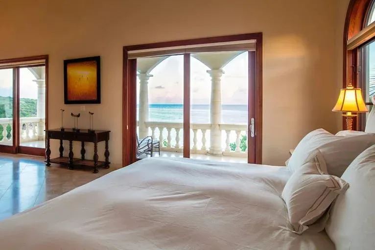 View from the master bedroom looking through open-concept access toward the ocean balcony.