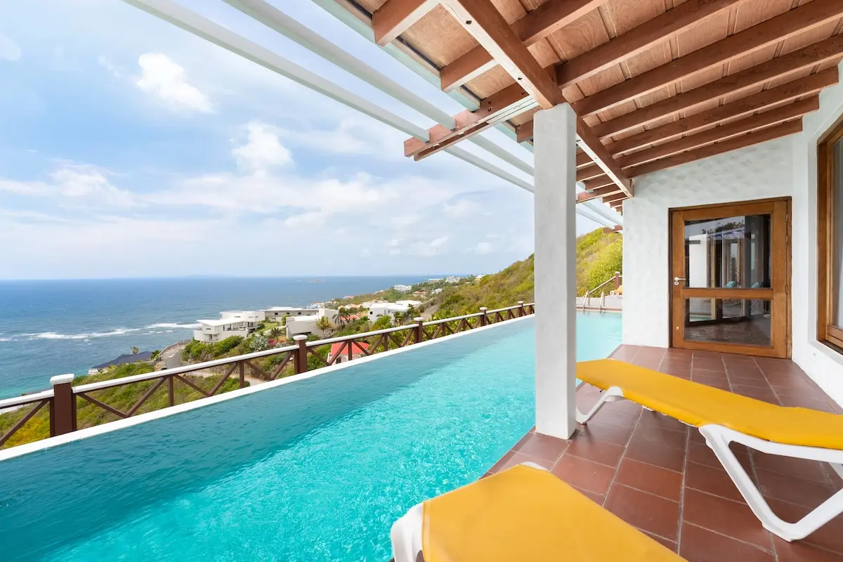 Infinity pool and terrace overlooking Oyster Pond and the ocean.