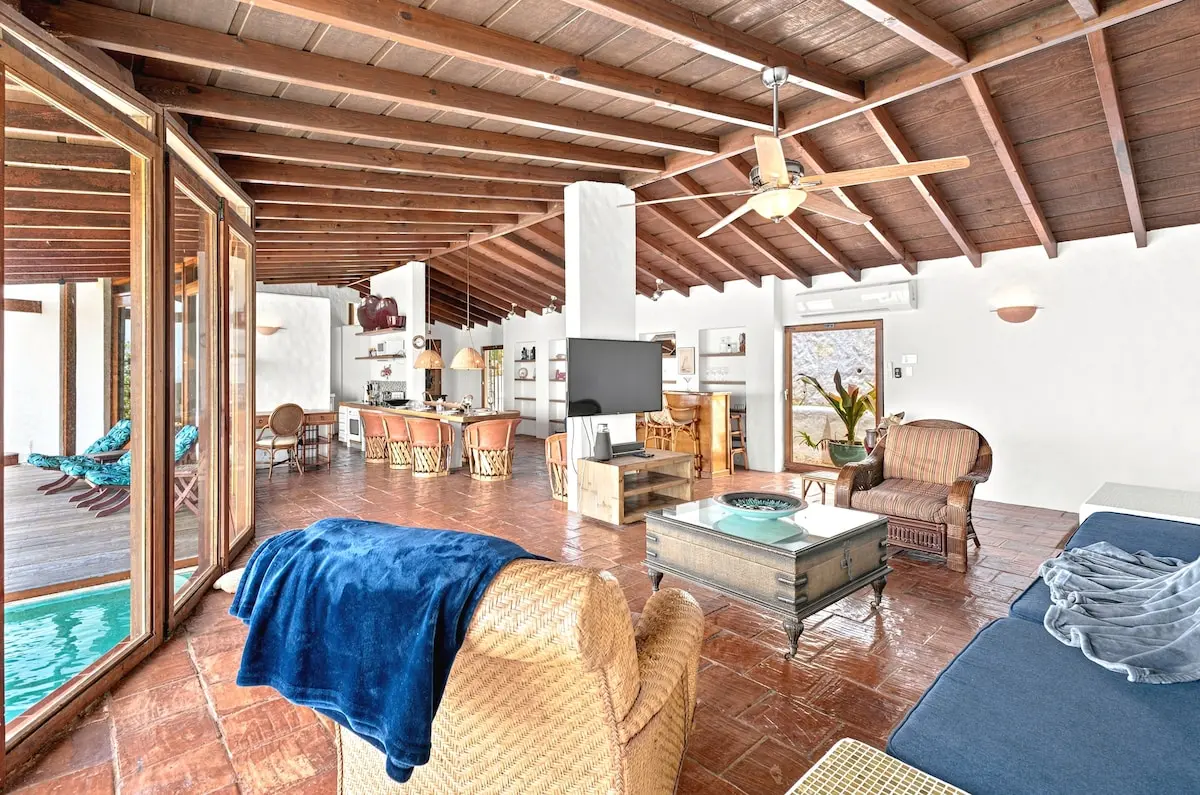 Open-air lounge with views toward the private pool.
