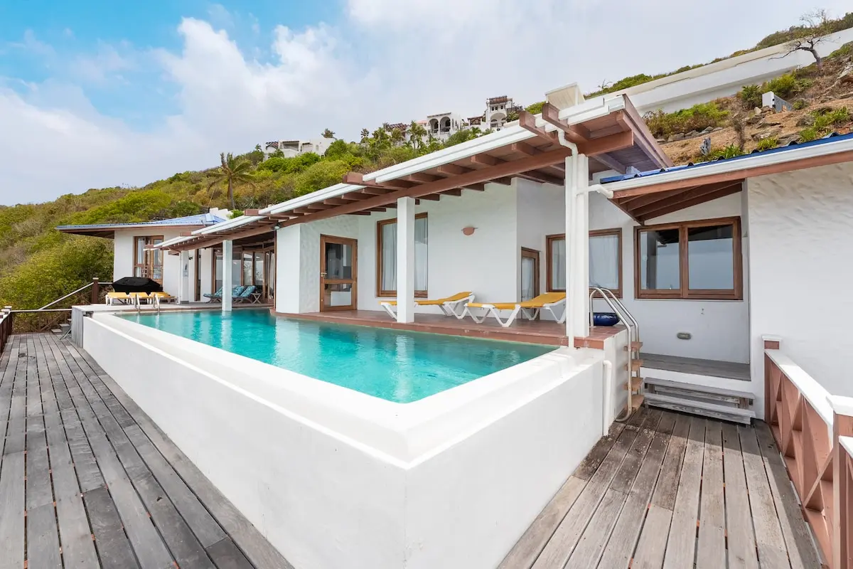 Bleu Haven villa exterior with private pool and ocean views in Oyster Pond.