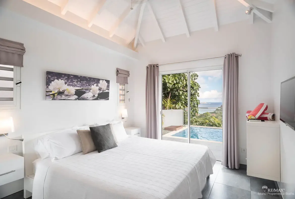 Your bedroom opens directly to the pool deck — step outside for a morning swim with ocean views.