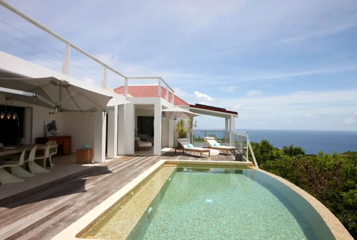 Soak in the St. Barths sun on the expansive hardwood deck surrounding your private infinity pool.