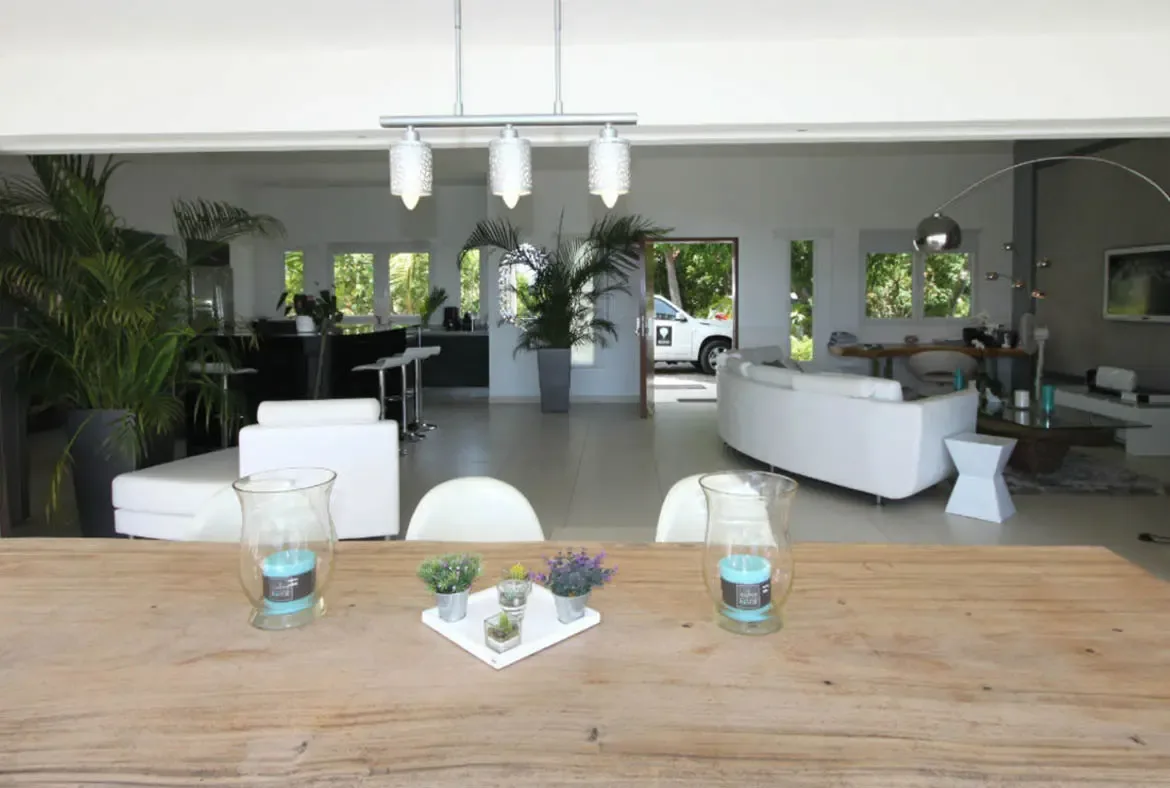 The seamless transition between indoor and outdoor living creates a light-filled atmosphere perfect for entertaining.