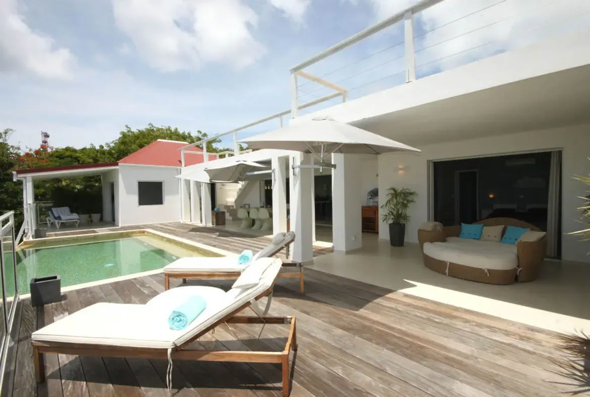 Unwind in style on the terrace's plush daybed, perfectly positioned to capture the cooling trade winds.