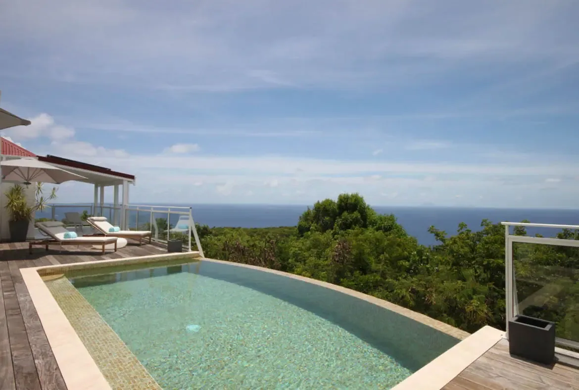 Experience absolute tranquility surrounded by lush tropical gardens and an endless ocean backdrop.