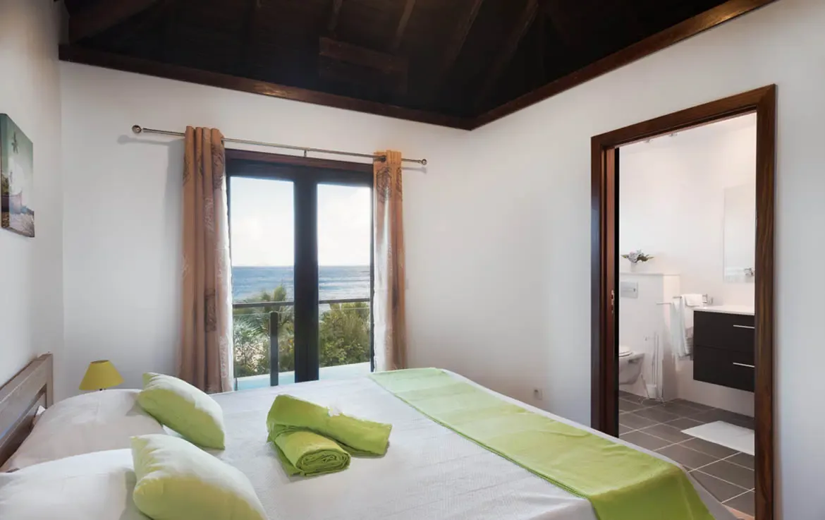 This bright and airy guest suite combines sophisticated comfort with direct views of the azure waters, ensuring every guest wakes up in paradise.