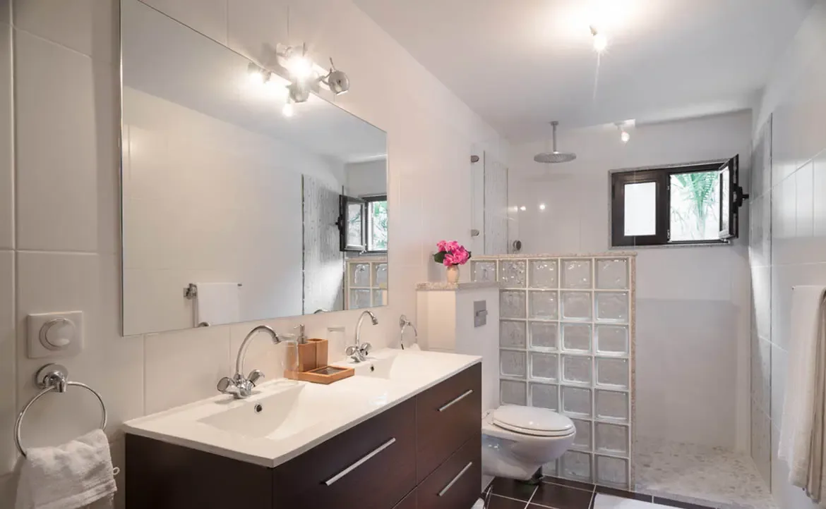 Experience ultimate relaxation in the sleek, modern bathroom at Villa Gem, featuring clean lines, premium fixtures, and a bright, airy atmosphere.
