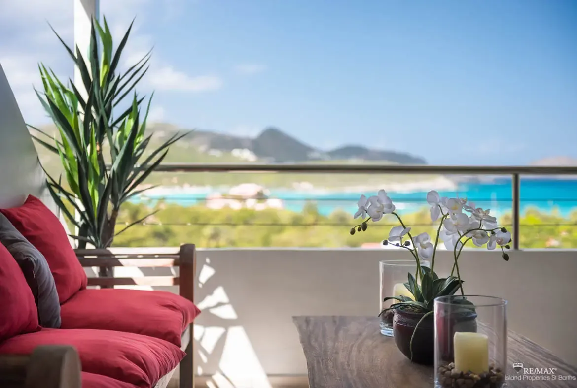 Your private terrace with panoramic views of the turquoise sea and island hills — the perfect Caribbean escape.