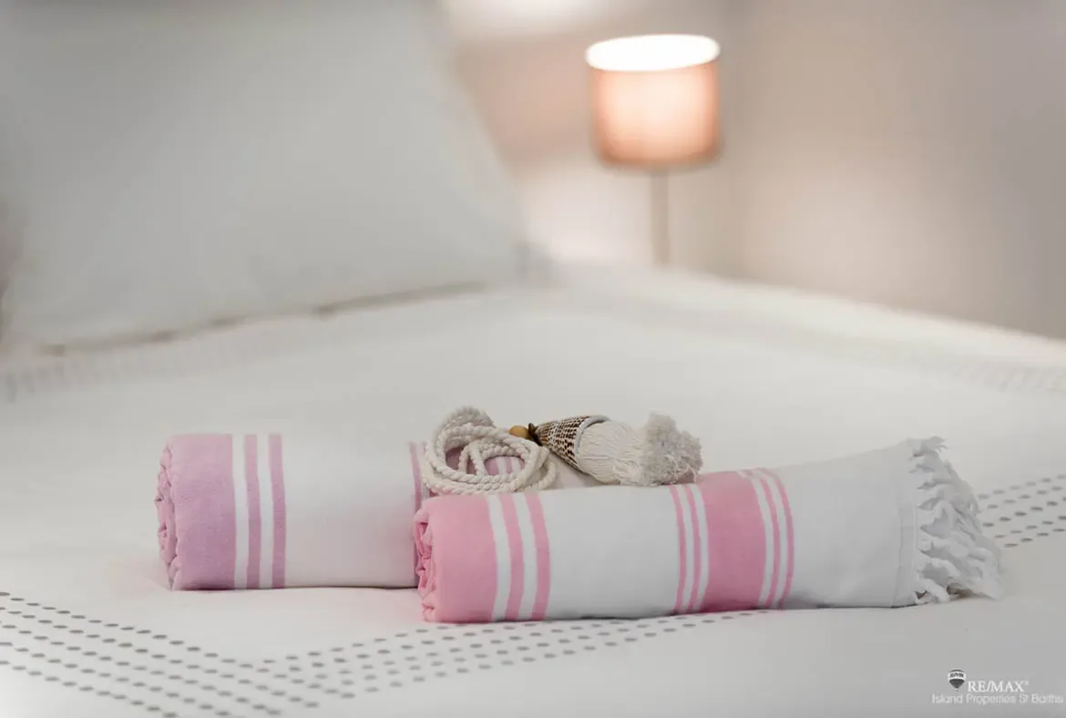 Thoughtful bedroom touches and fresh linens set the tone for a relaxed island stay.