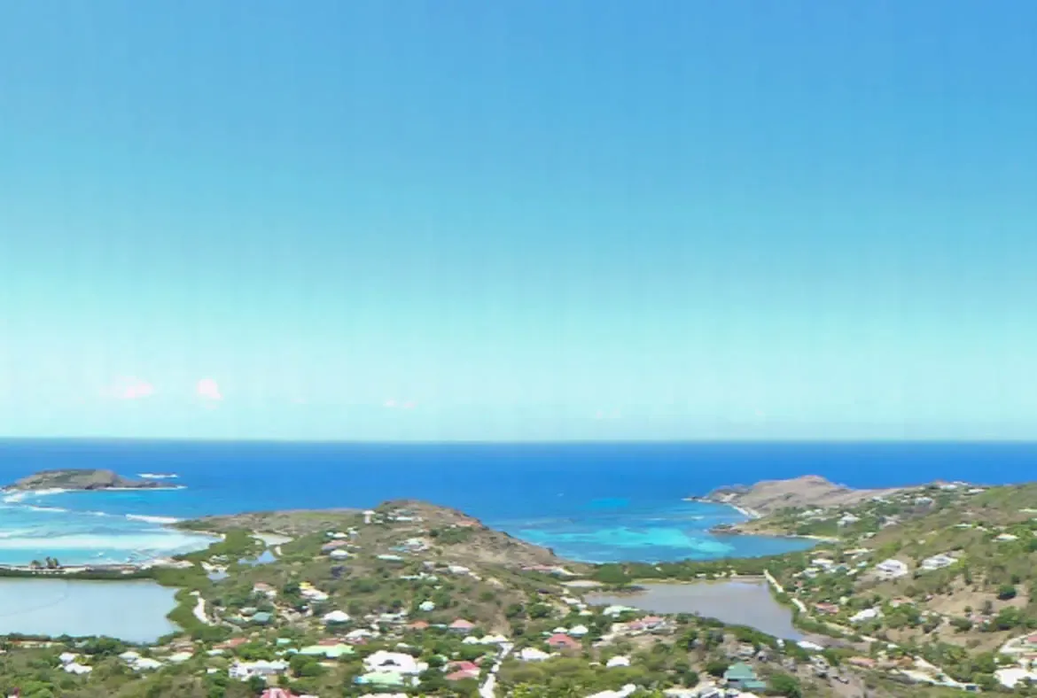 Take in the breathtaking panoramic ocean views from Villa Agave Azul, where turquoise waters stretch to the horizon under a cloud-dotted sky. This serene coastal landscape invites you to unwind in luxury amidst St. Barths' natural beauty.                                                                                                                                                                                                                                                                     +
 