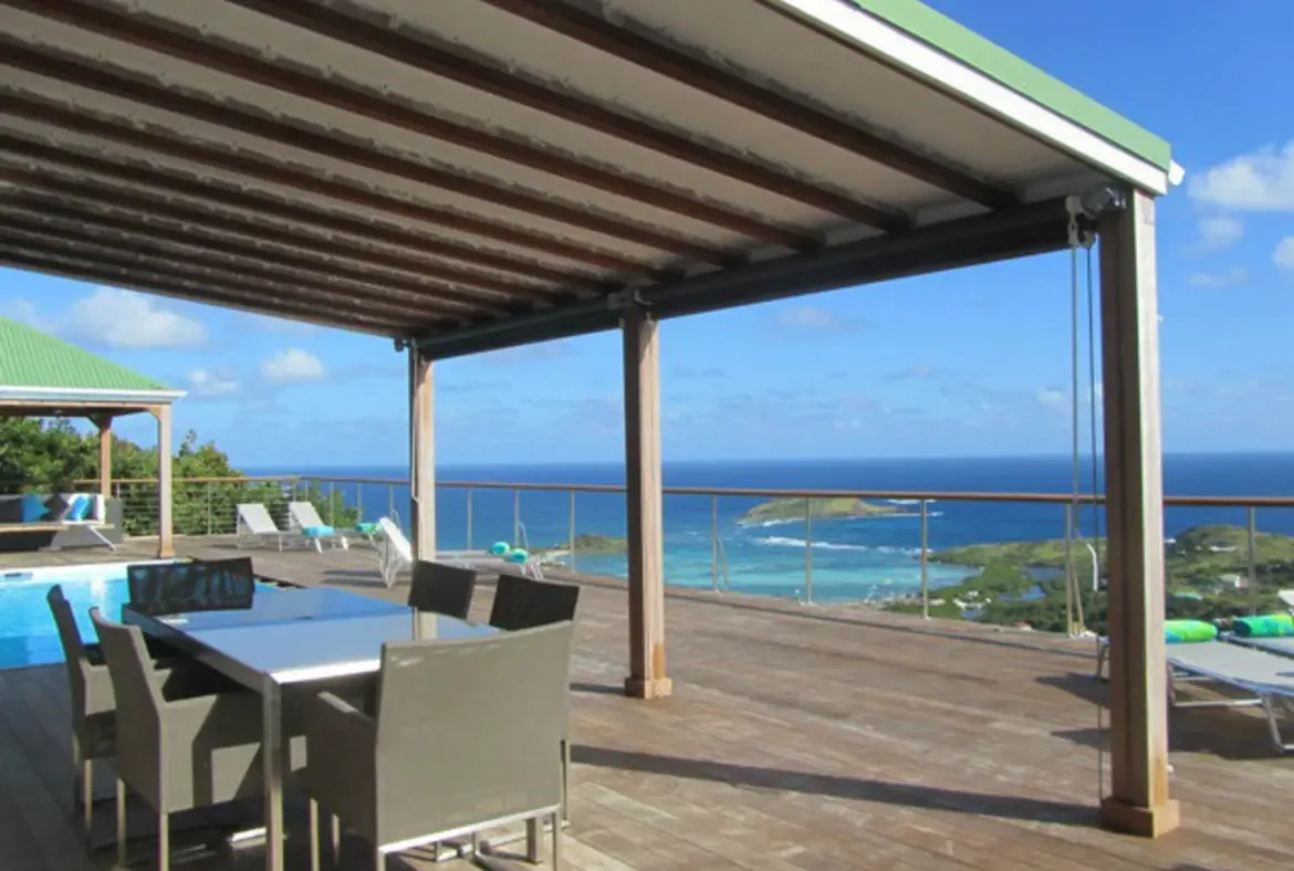 Gather for al fresco meals under Villa Agave Azul's shaded terrace, where panoramic Caribbean vistas and cooling trade winds elevate every dining moment. Let the endless blue horizon and sun-drenched deck set the tone for relaxed luxury in St. Barths.                                                                                                                                                                                                                                                    +
 