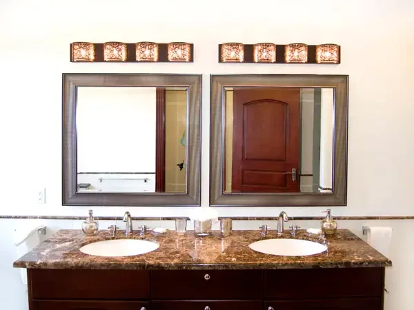 Sophisticated bathroom with double marble vanity and premium fixtures — pamper yourself in style.