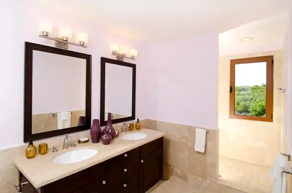 Contemporary bathroom with marble vanity and glass-enclosed shower — clean lines and refined finishes.