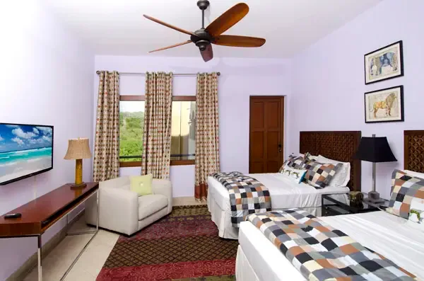 Inviting guest bedroom with two comfortable twin beds — perfect for friends or family.