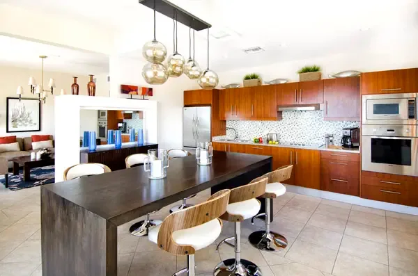 Stunning kitchen island with golden pendant lights — the heart of this beautifully designed home.