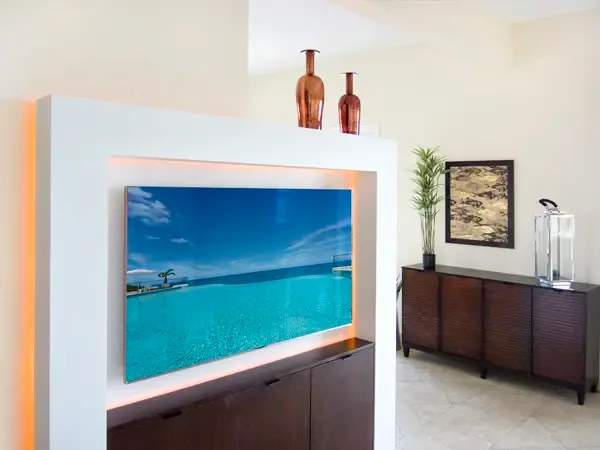 Modern entertainment area with integrated TV and ambient lighting — cozy nights in with style.