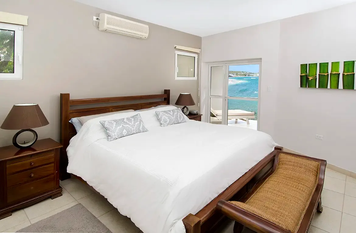 Drift to sleep with sliding doors open to the ocean breeze in the master suite.