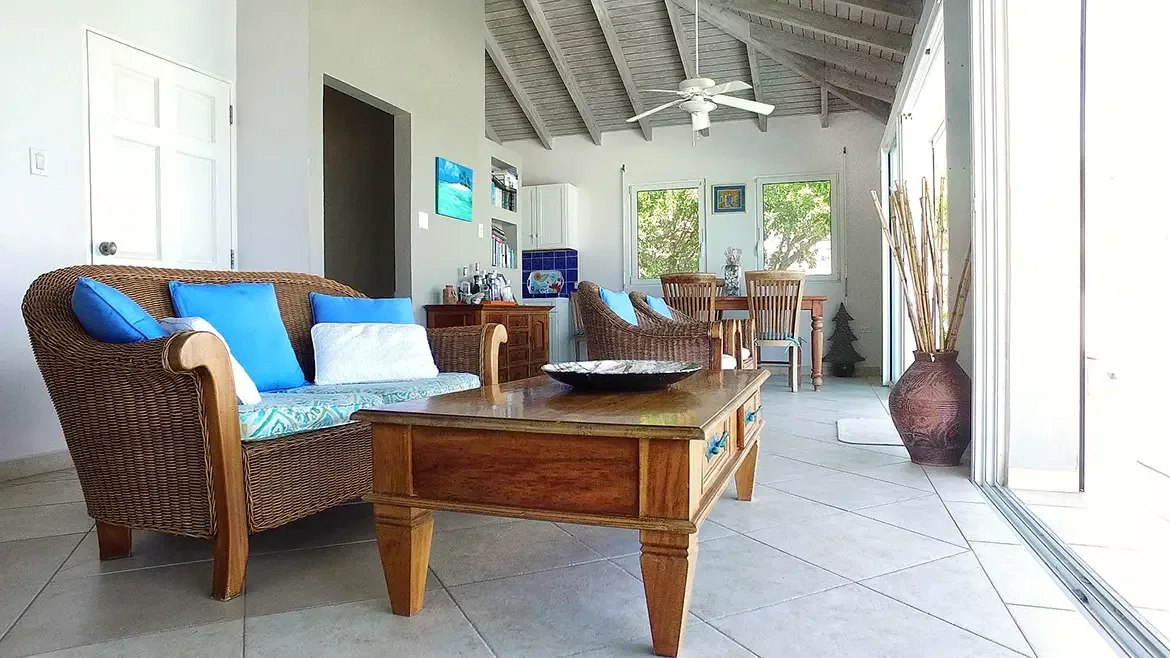 Spacious open-concept living and dining with vaulted ceilings and tropical elegance throughout.