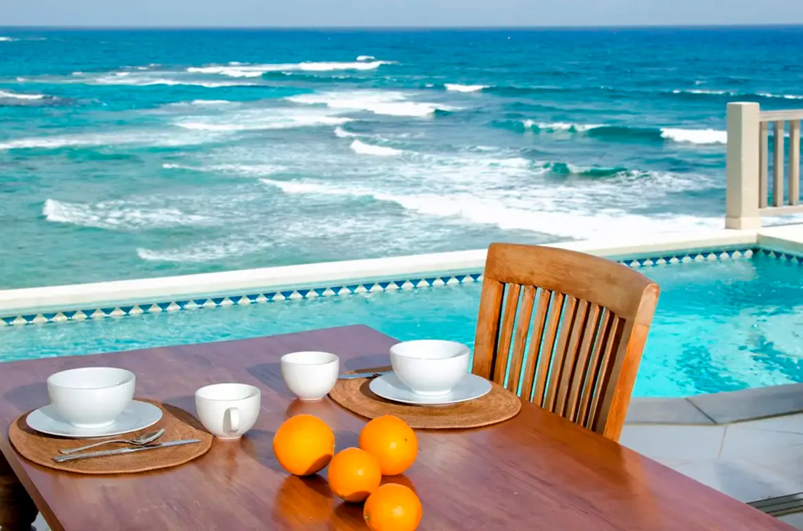 Fresh tropical breakfast by the pool — the perfect start to your beachfront morning.