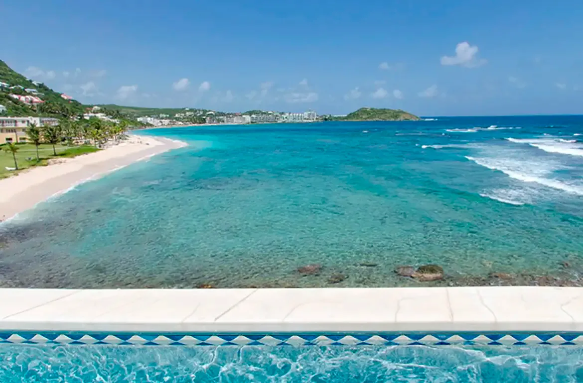 Your infinity pool overlooks the beach and resort — the perfect blend of privacy and paradise.
