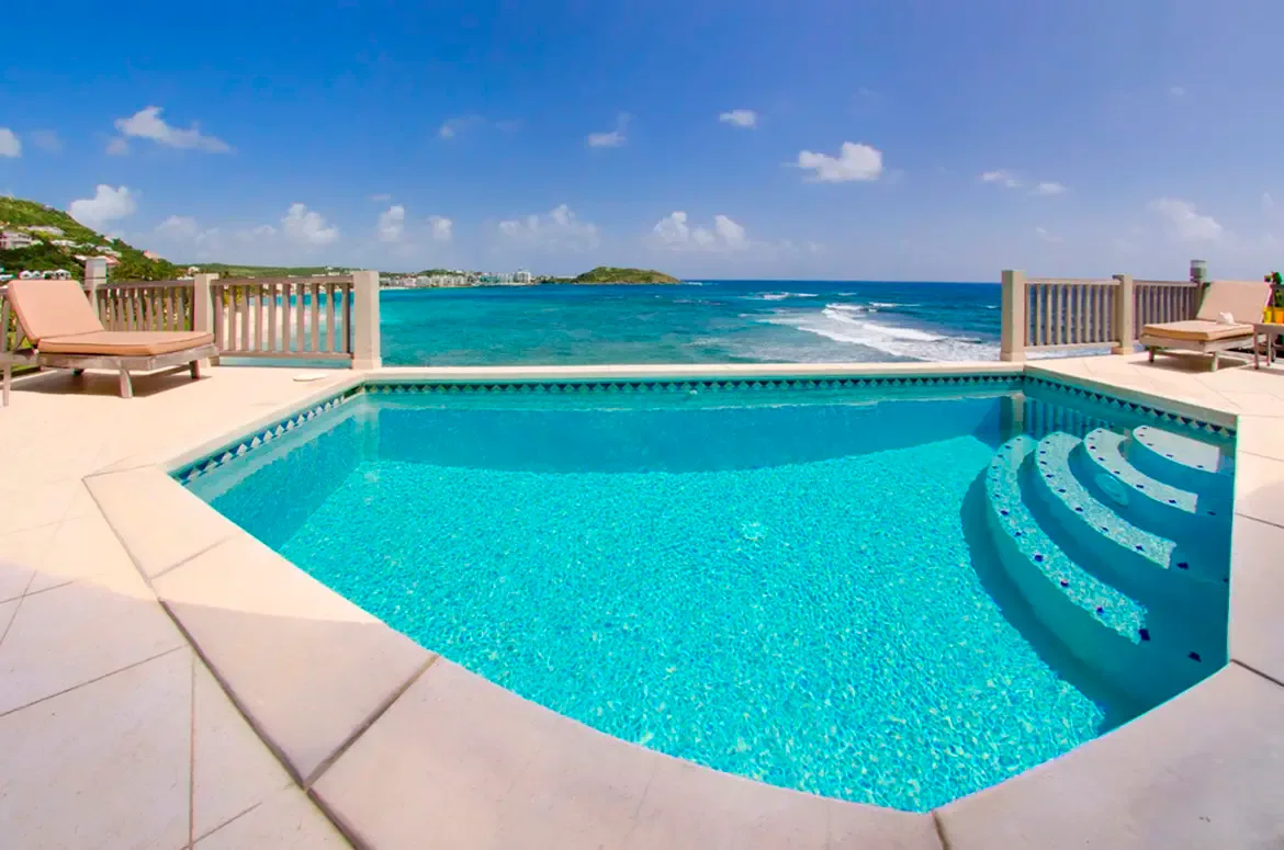 Relax by the turquoise infinity pool with uninterrupted ocean views — your private oasis awaits.