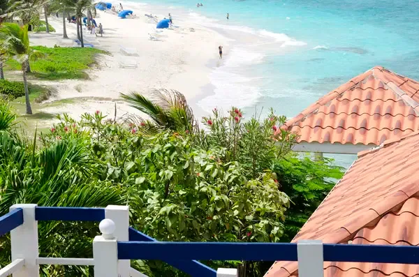 Step onto your balcony and drink in the view — Dawn Beach stretches before you, just steps from your door.