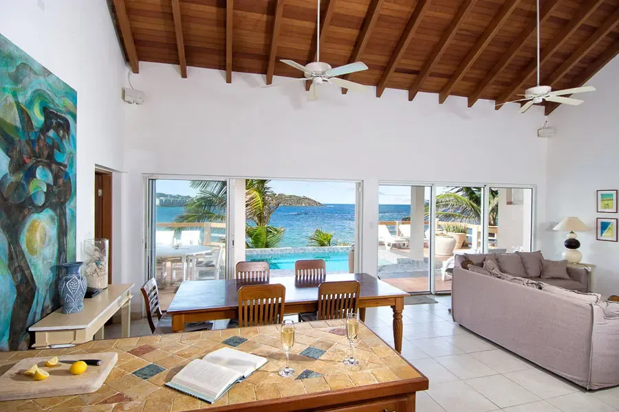 Breathtaking ocean views from every angle — an open-concept living and dining area designed for seamless indoor-outdoor living.