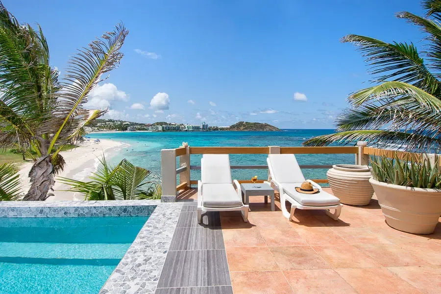 Elegance meets nature — your pool terrace overlooks Dawn Beach with style.